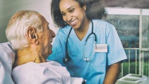 female nurse with elderly male patient